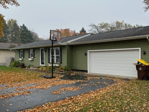 Front of a ranch style home in the fall