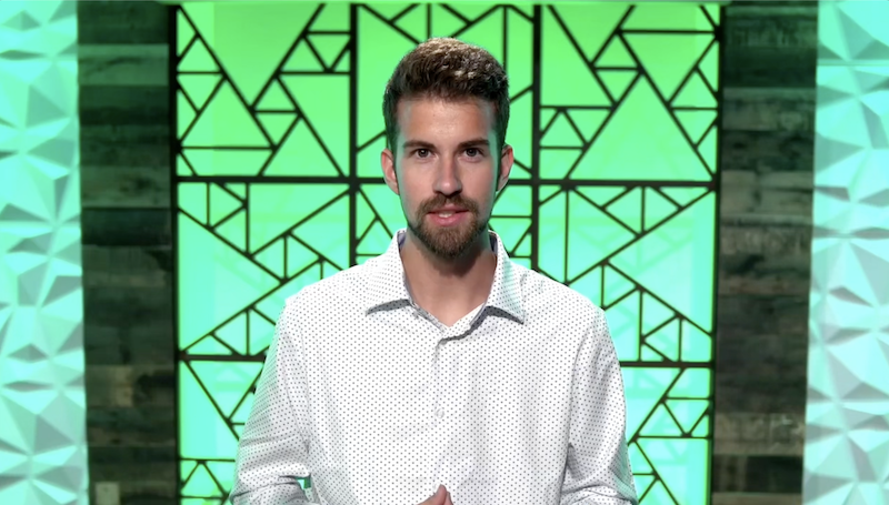 Sustain Services realtor standing in front of a green background