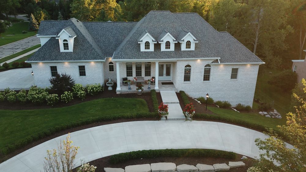 An aerial picture of a home with beautiful landscaping